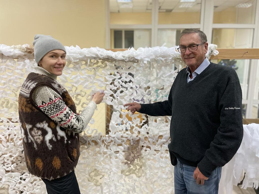 Lord Ashcroft at the humanitarian centre, Odesa, with a woman volunteer making camouflage nets for frontline Ukrainian soldiers. (21/12/2022) 